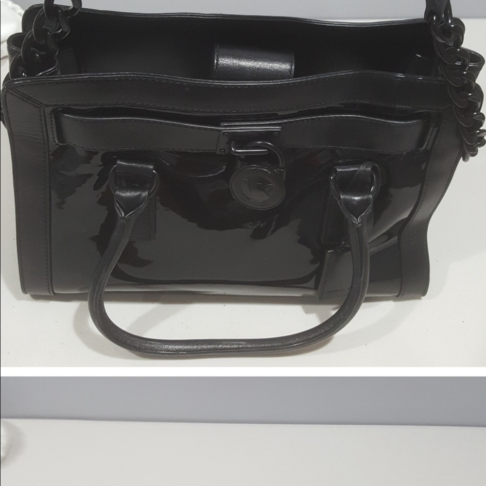 Black patent leather bag with leather side panels. Great condition.